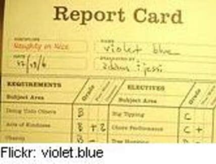Vintage report card showing grades and requirements in cursive handwriting