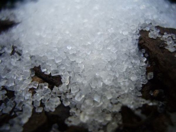 image of a close up of sugar crystals on a dark surface signifying the potential link between diabetes and Alzheimer's