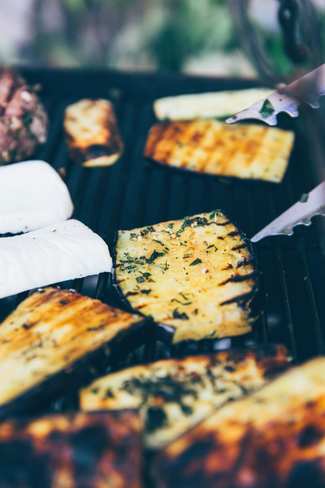 easy grilled vegetables on grill rack with tongs via Organic Authority