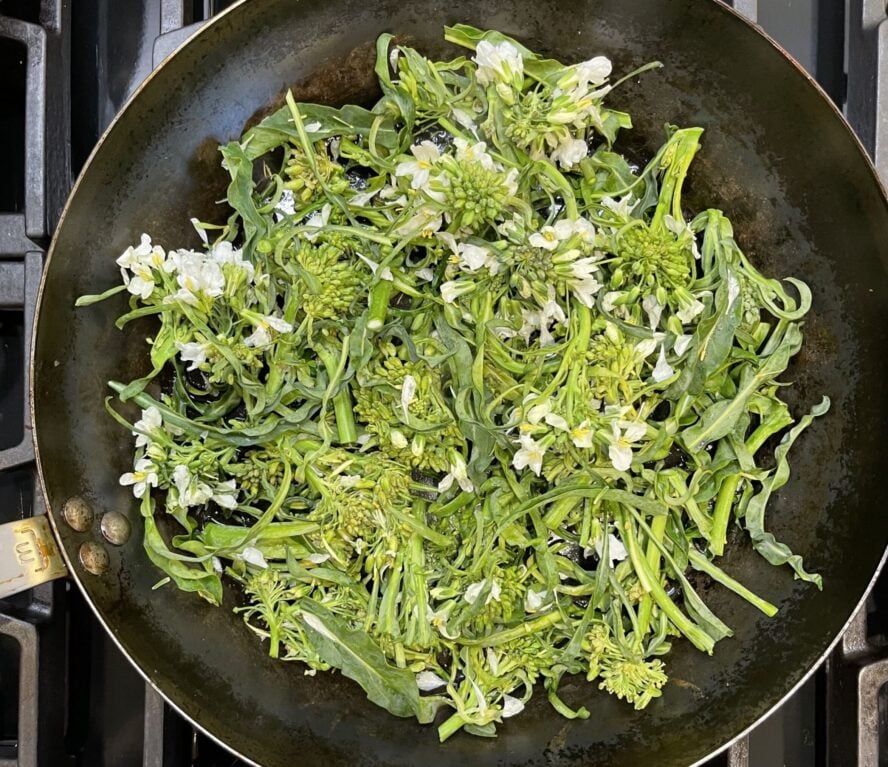 Searing greens in Made In's carbon steel 12" pan.