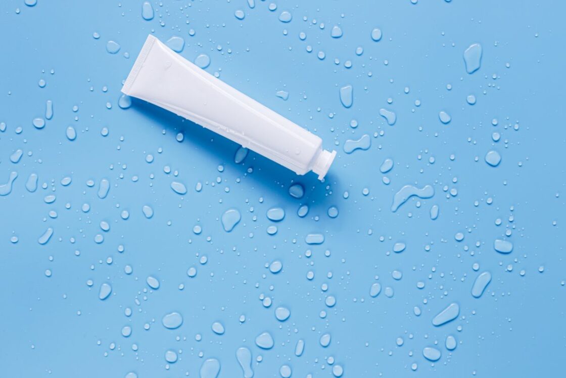 image of natural skin serum bottle on blue background via Organic Authority