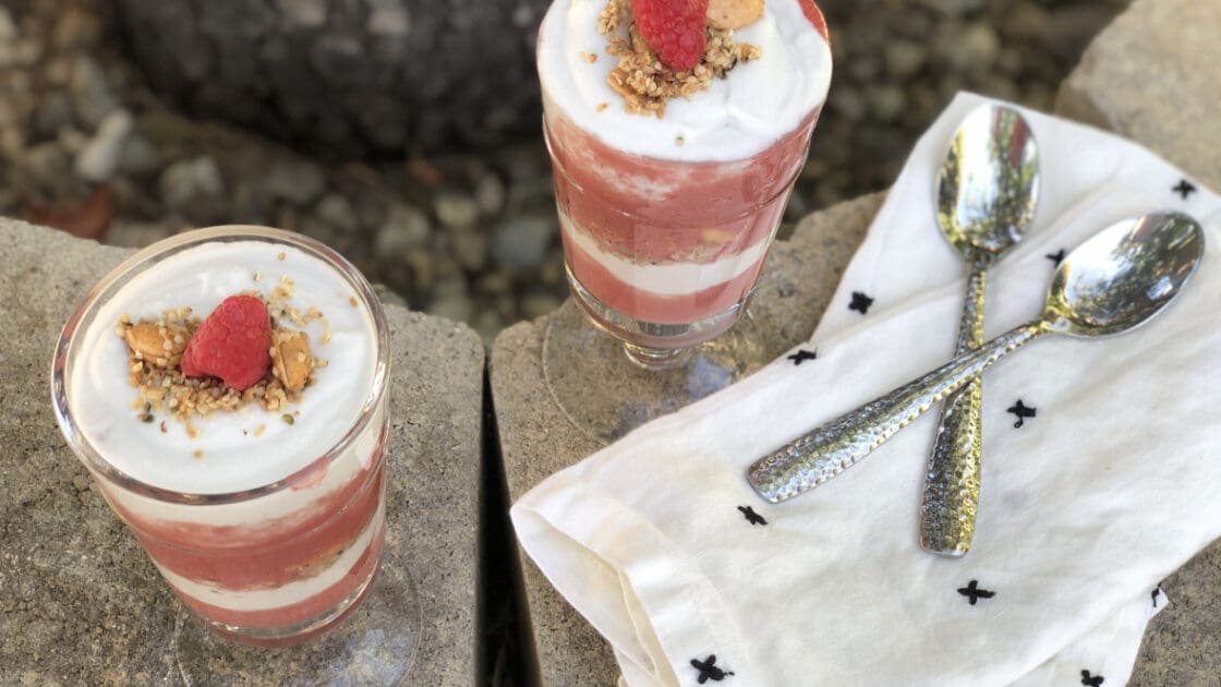 Two glasses of raspberry coconut parfait.