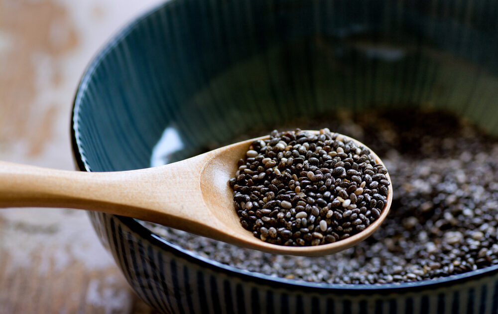 scooping chia seeds from a bowl