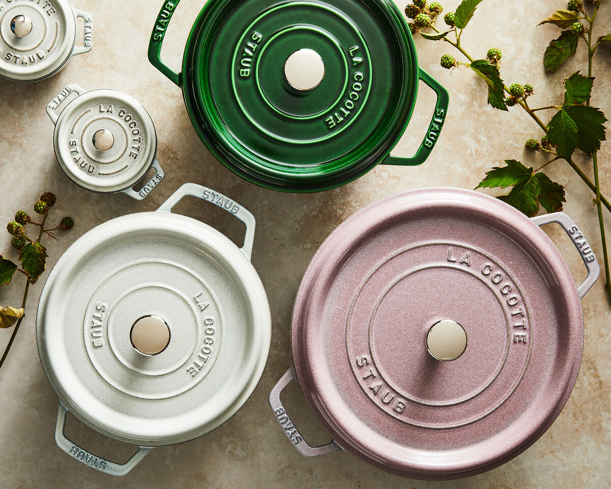 Image of three Staub Dutch Ovens (cocottes) in three gorgeous colors, all slightly different sizes.
