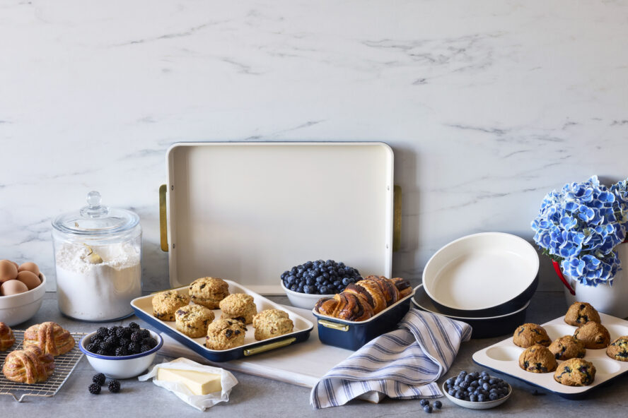 Image of the 7-piece GreenPan Reserve Bakeware set in Twilight, shown with baked goods like blueberry scones and chocolate babka.
