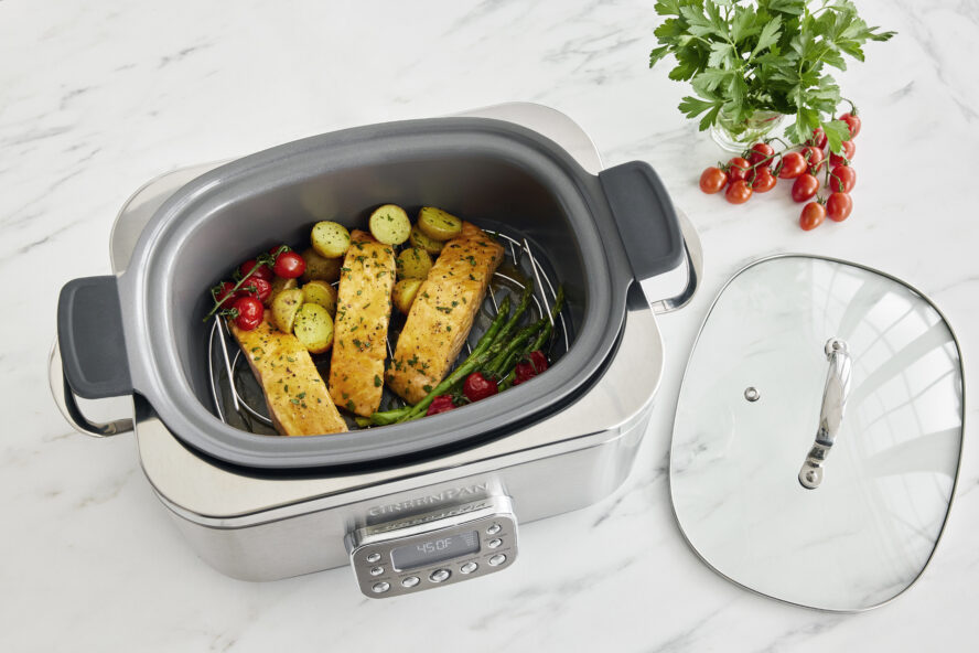 Image of a GreenPan Slow Cooker in a stainless steel finish looking sleek on a white marble countertop with a white marble backsplash