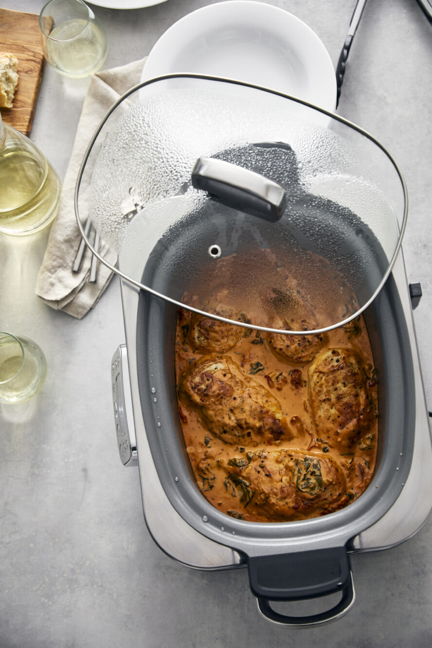 Image of the GreenPan Elite 14-in-1 slow cooker with savory, stewed chicken that's perfect for weeknight meals.