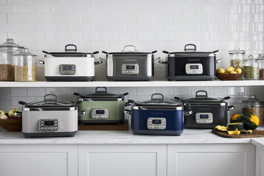 Image of the GreenPan Elite 14-in-1 slow cooker in all 7 colors available, displayed on a kitchen counter and shelf.