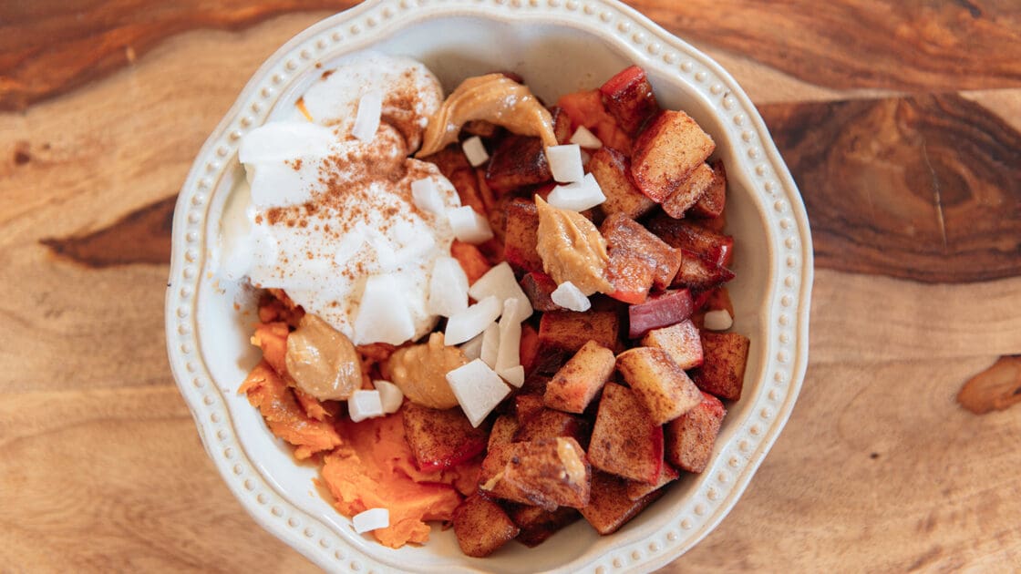 image of a sweet potato breakfast bowl served in a pretty bowl. This yummy bowl is super easy to put together.