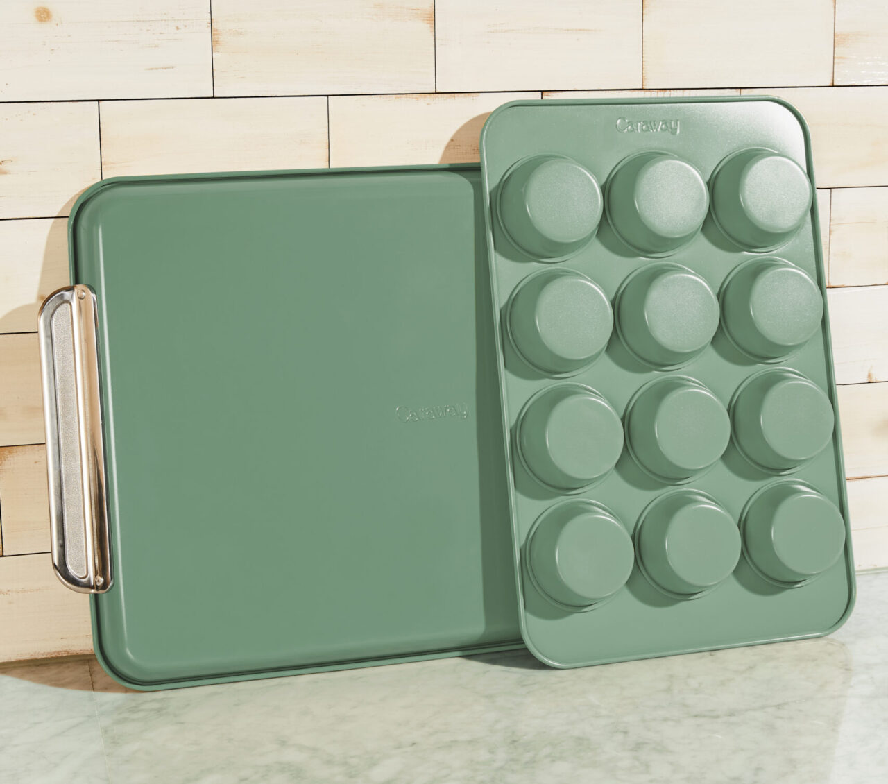Image of the Caraway muffin pan and baking sheet in a warm green color.