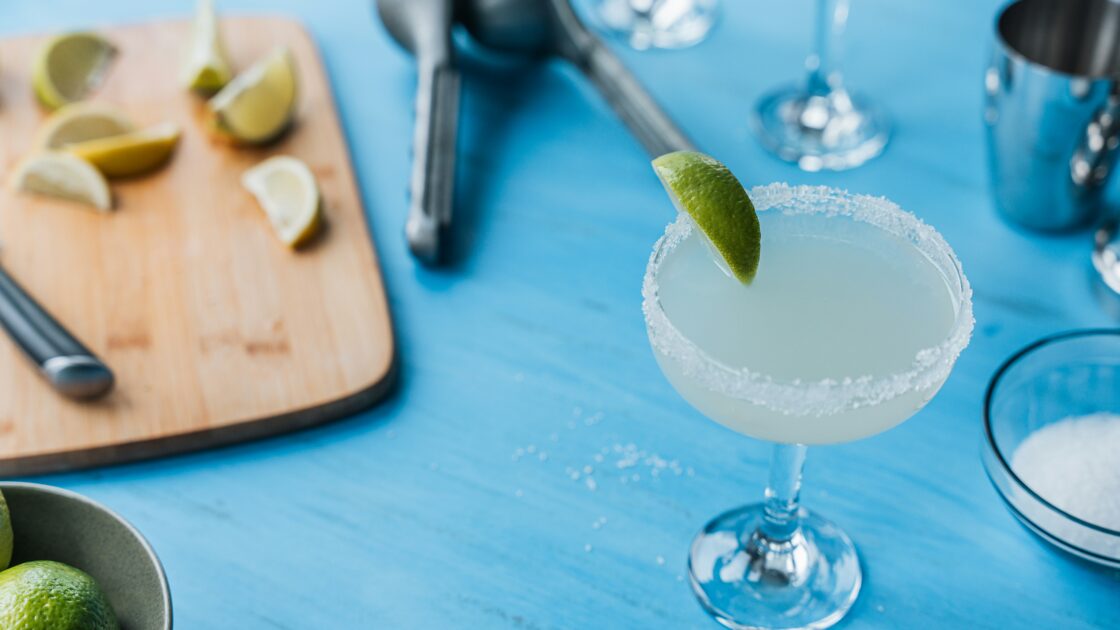 image of a traditional margarita, the real thing with a salted rim and lime