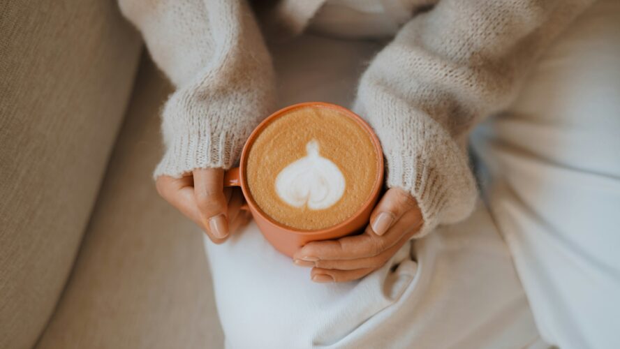 how to make pumpkin pie latte syrup at home, woman holding homemade pumpkin spice drink
