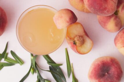summer cocktail recipe, a grilled peach whiskey sour