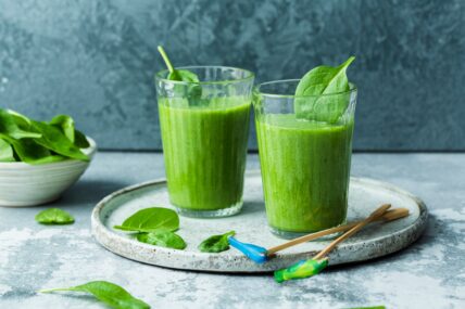image of two glasses of green smoothies with spinach
