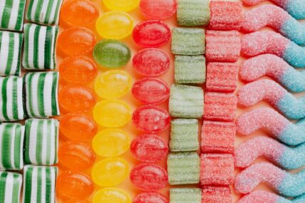 Image of several rows of colorful candies that make use of synthetic food dyes for their bright hues.