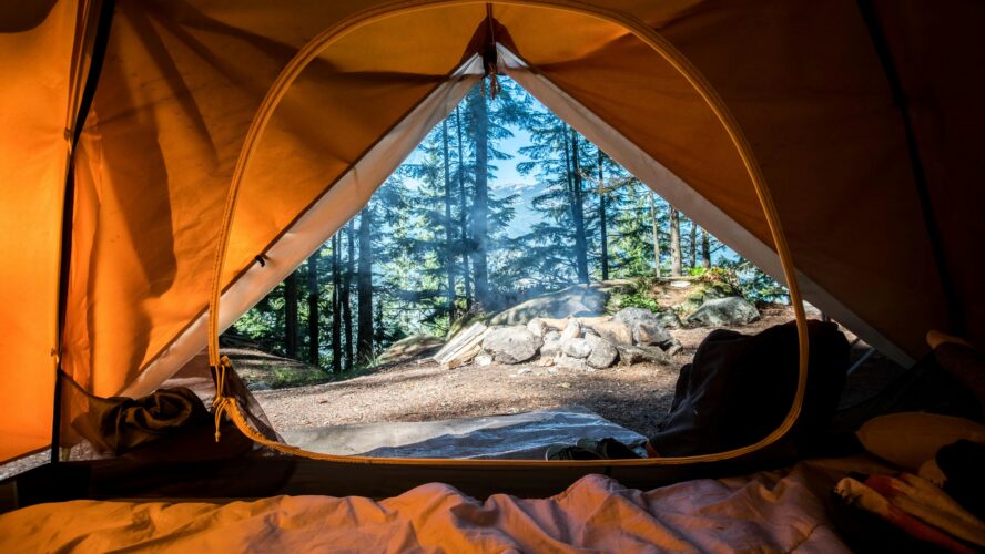 image of the view through a tent, where you should have clean camping cooking ware