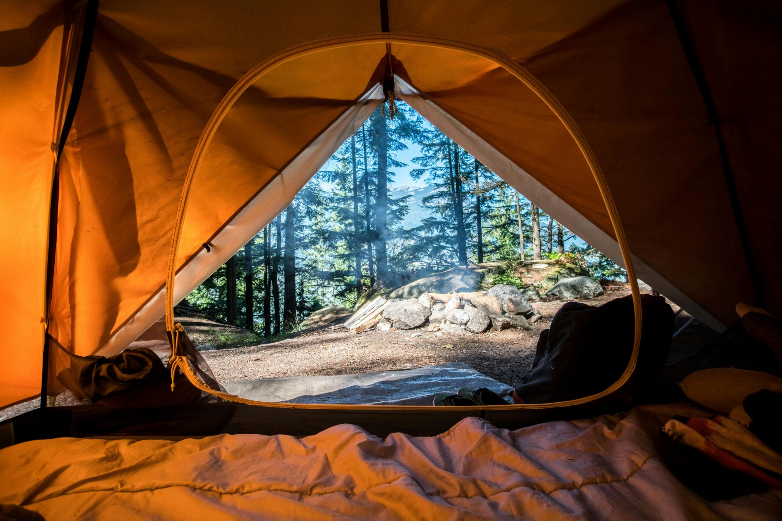 image of the view through a tent, where you should have clean camping cooking ware