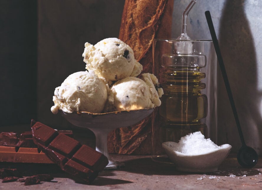 Image of a bowl of ice cream with a french vanilla ice cream base, studded with chocolate and other toppings.
