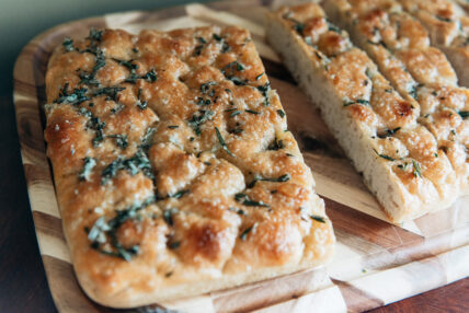 This focaccia recipe is easy, fast, and delicious, thanks to an extra dusting of herby garlic butter sauce.