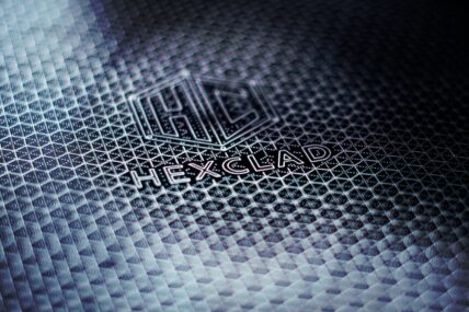 Close-up image of a HexClad pan with the logo and the classic HexClad pattern.