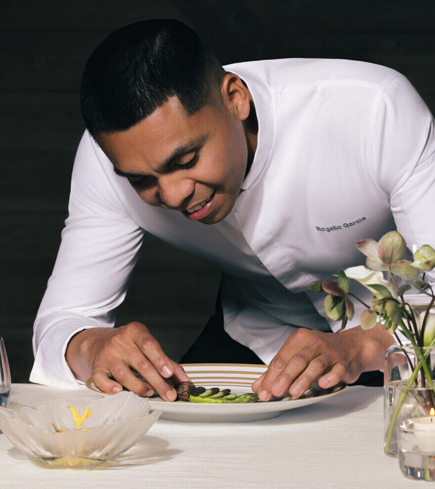 Image of Chef Rogelio Garcia of Auro restaurant plating up a gorgeous dish that's part of a set menu.