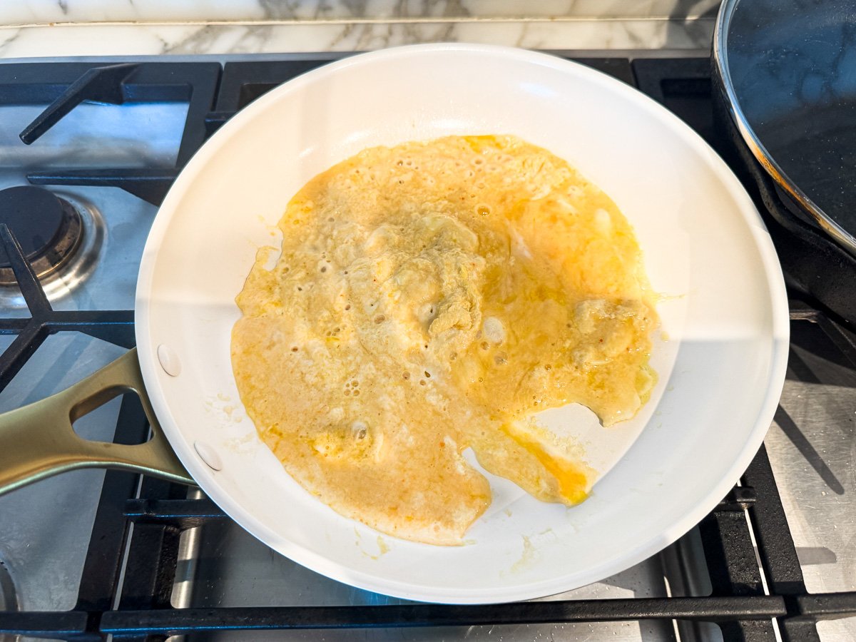 Image of a GreenPan Reserve Pro frypan cooking an omelette with no issues with sticking or hotspots. 