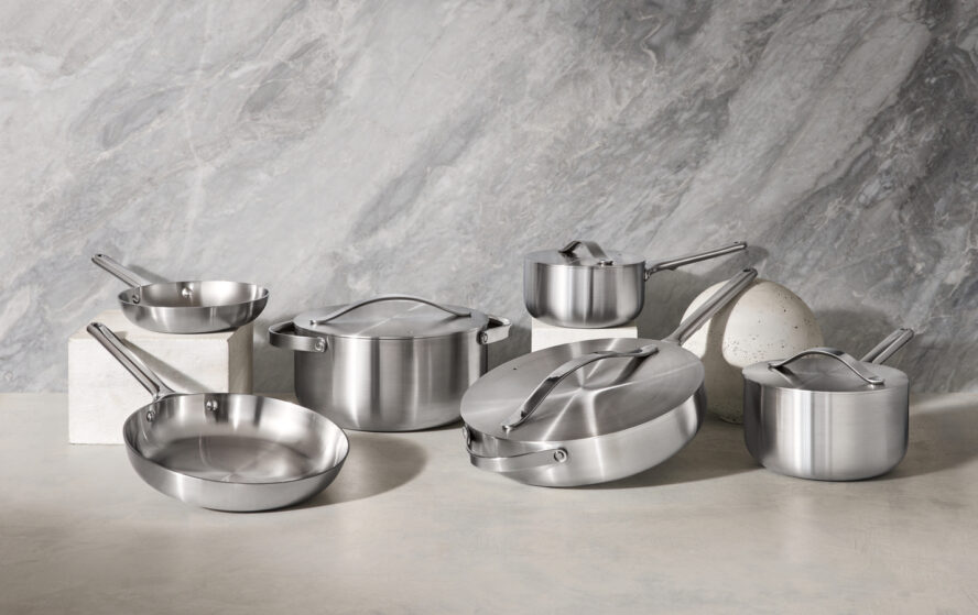 Image of Caraway Stainless Steel Cookware set displayed against a marble backdrop.