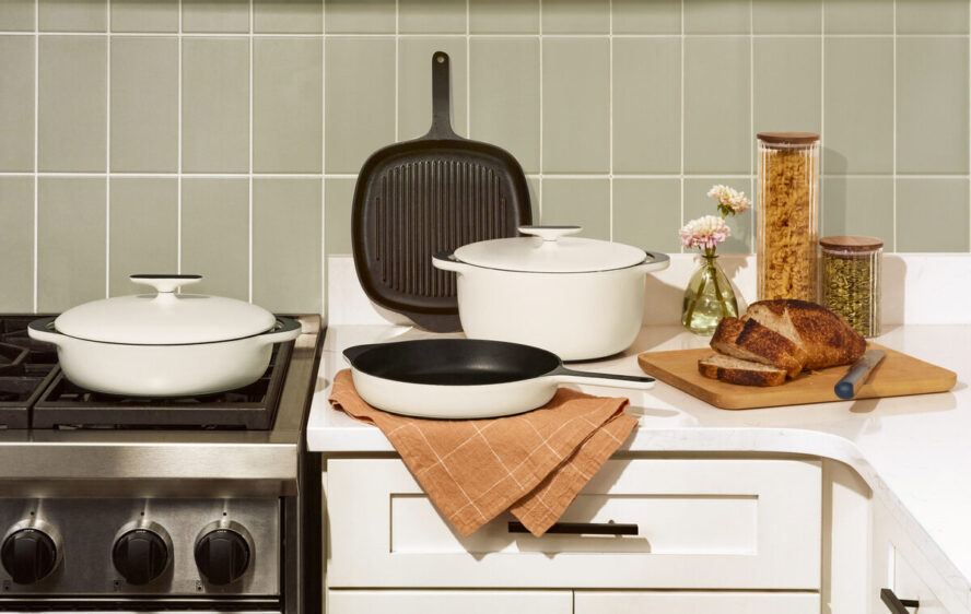 Image of several pieces in the Caraway Cookware enameled cast iron collection, including the Dutch oven.