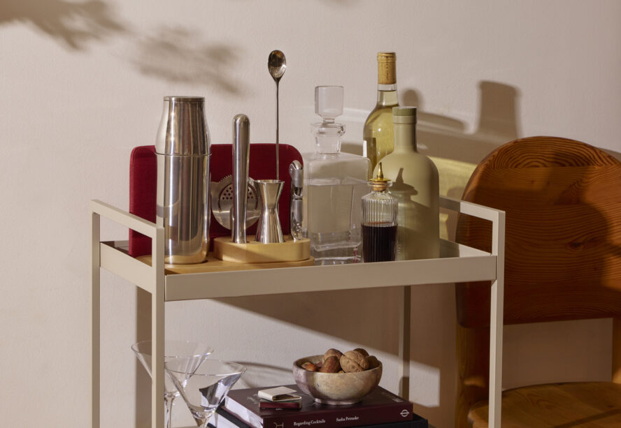 Image of the Caraway Complete Bar Set displayed neatly on a chic bar cart.