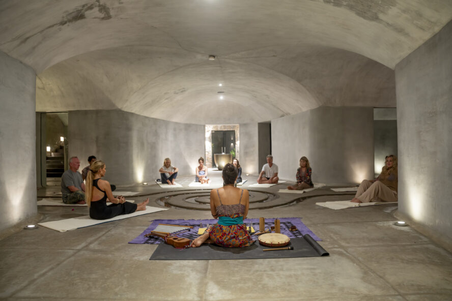 Image of a group of ZihFit wellness seekers sitting in a circle and enjoying a sound bath experience.