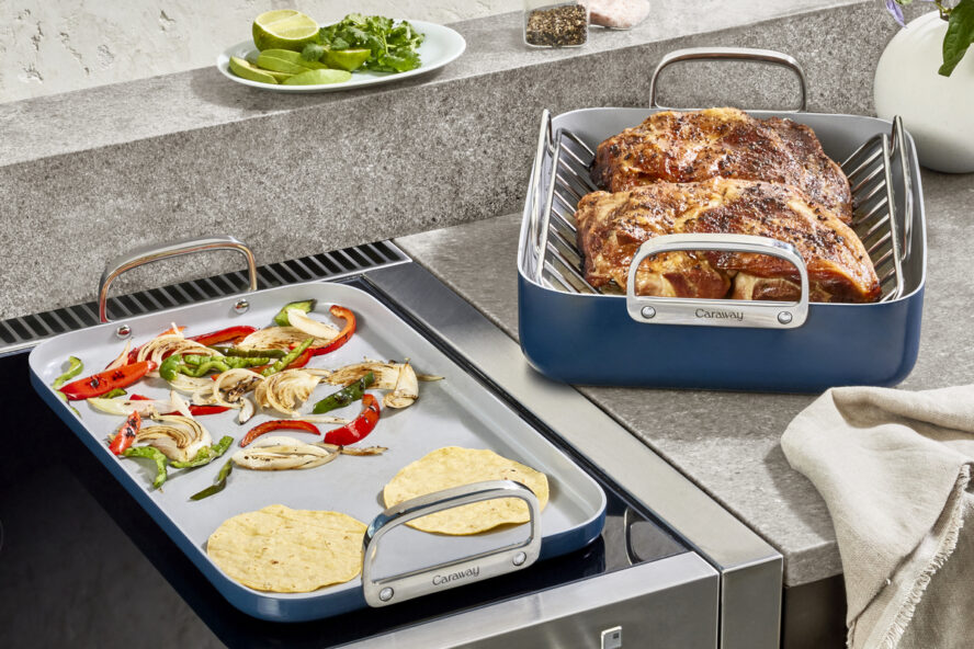 Image of the Caraway Double Burner Griddle in navy, being used to fry vegetables and warm up tortillas for tacos.