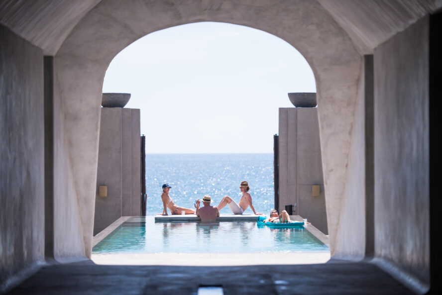 Image of ZihFit guests lounging and enjoying the saltwater grotto carved into the cliffs.