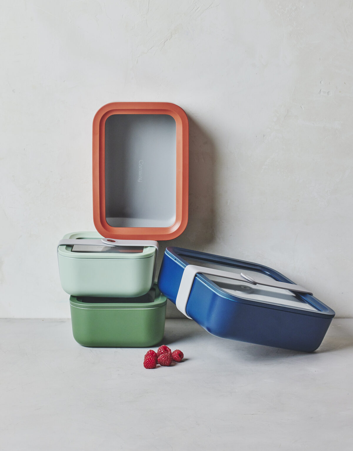 Image of the Caraway Food Storage containers in multiple colors stacked on top of each other.
