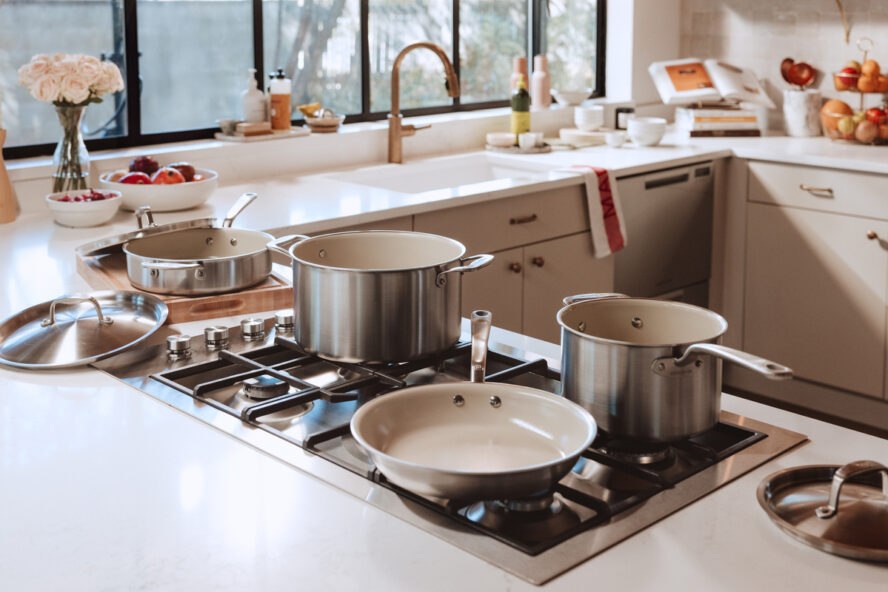 Image of a full set of Made In CeramiClad 7-piece cookware shown on a kitchen stovetop.