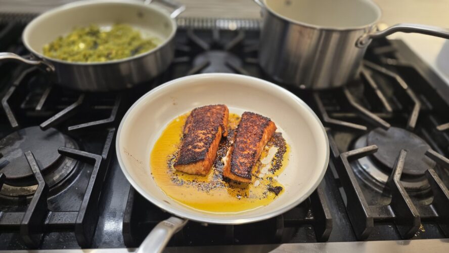 Image of the Made In CeramiClad 10-inch Frying Pan searing two gorgeous salmon filets.