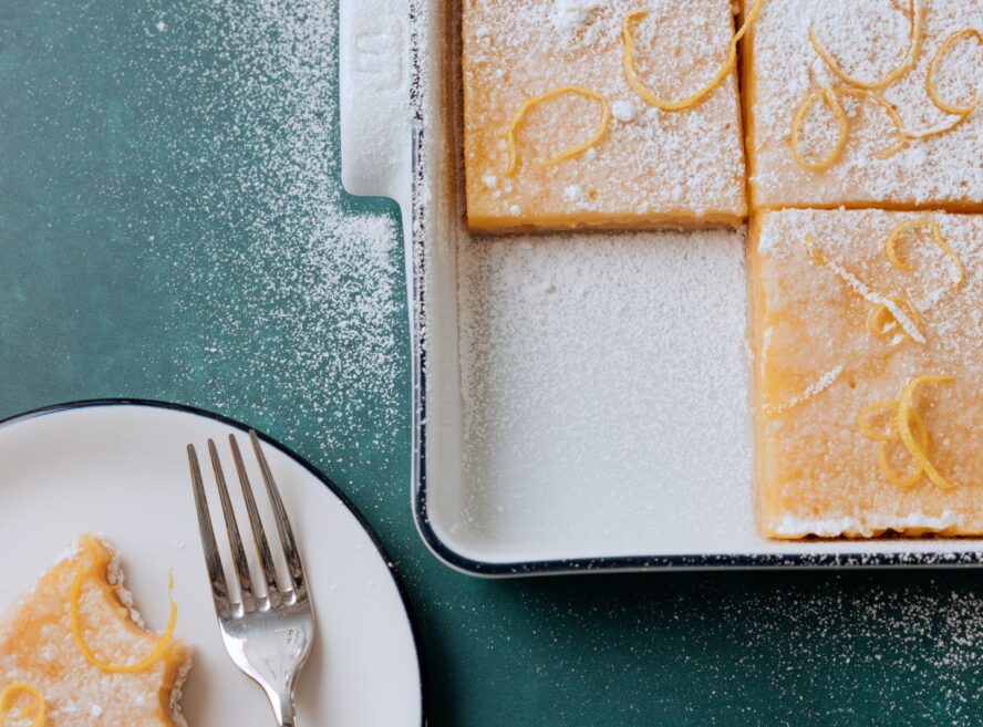 Image of the Made In porcelain baking slab with a navy stripe, being used to cook and serve lemon bars.