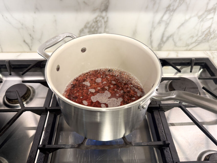 Image of the Made In stock pot full of purple rice boiling under an inch of water.