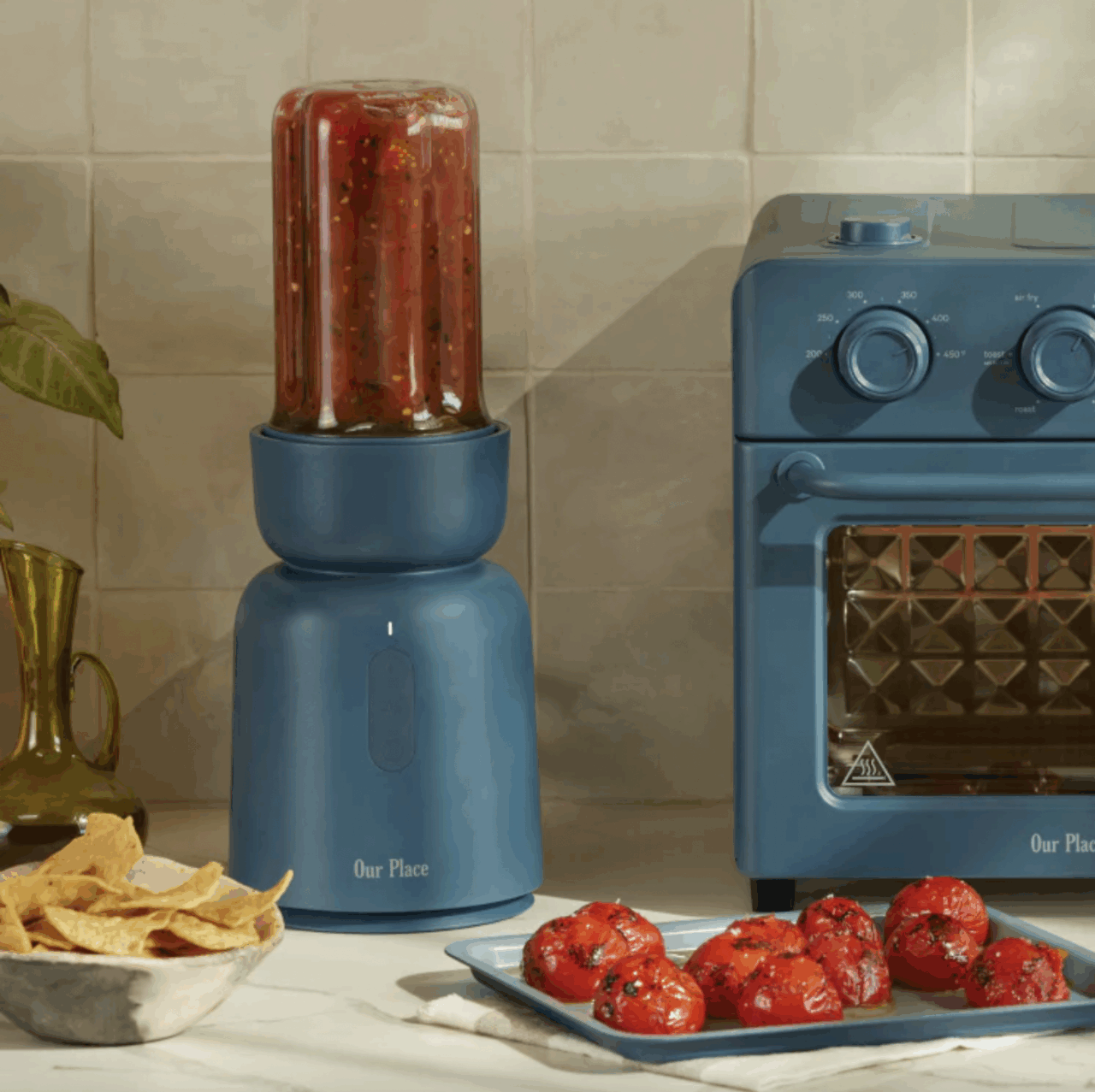 Image of the Our Place Splendor Blender in Blue Salt, being used to create a vibrant roasted tomato salsa.