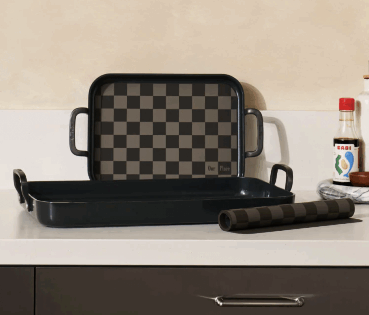 Image of the Our Place Essentials Griddle set with four pieces, two griddles and two reusable silicone mats.