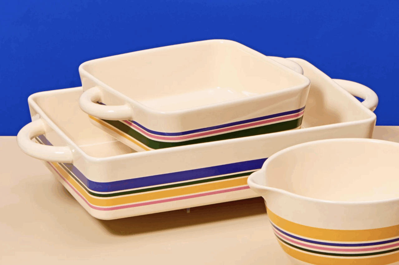 Image of two Great Jones Hot Dishes in the striped colorway in different sizes, nested inside each other.