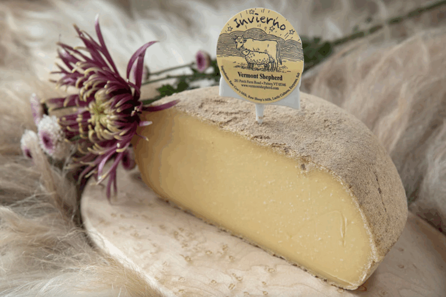 Image of a half wheel of Invierno, a semi-hard natural rind cheese from Vermont Shepherd.