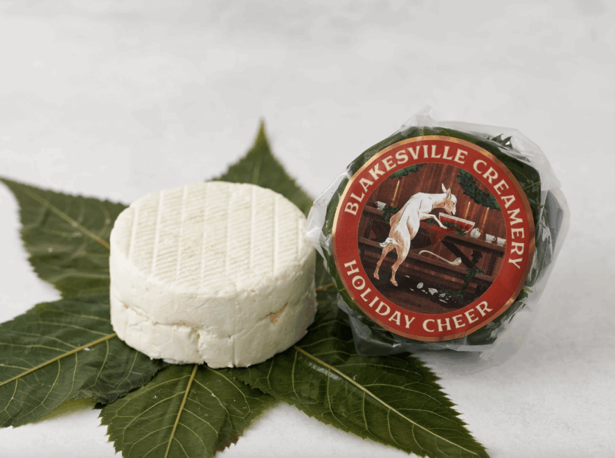 Image of a small wheel of Holiday Cheer cheese from Blakesville Creamery.