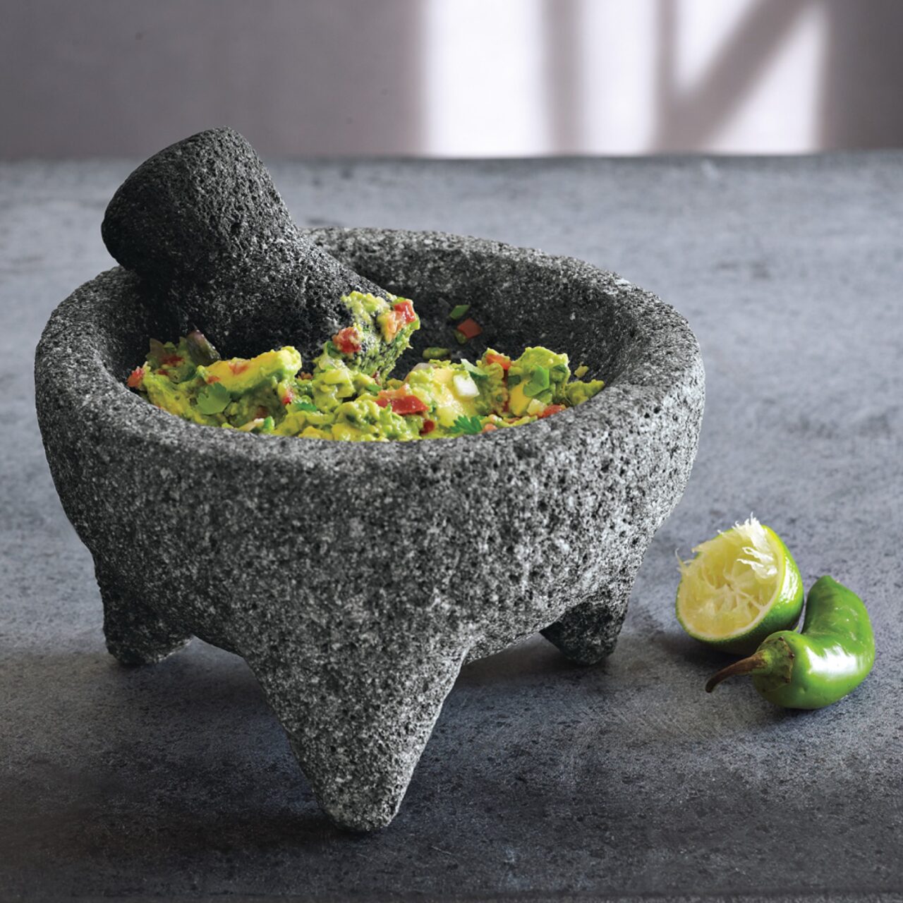 Image of the Williams Sonoma molcajete filled with freshly made guacamole.