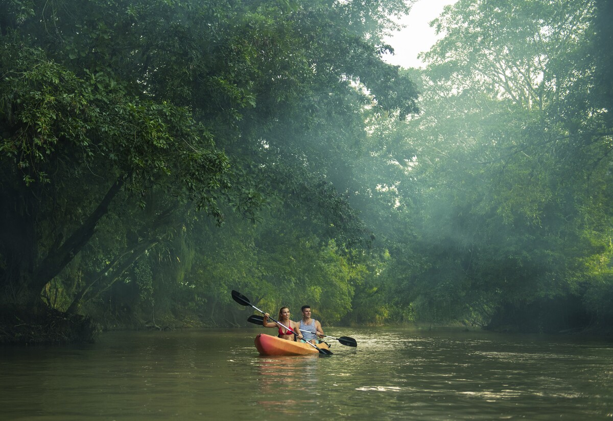 Image of a couple on a kayak in a river in Costa Rica.