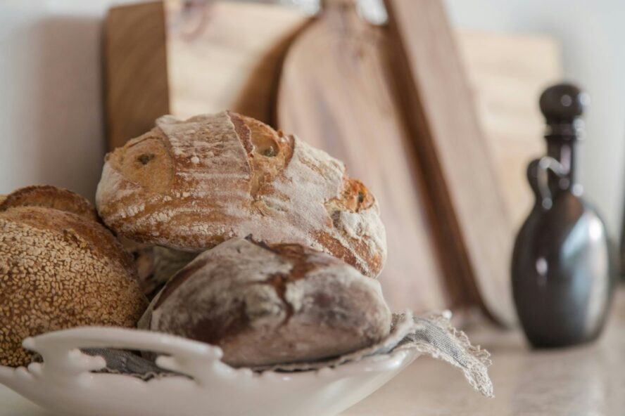 Image of three loaves of sourdough bread stacked on top of each other.