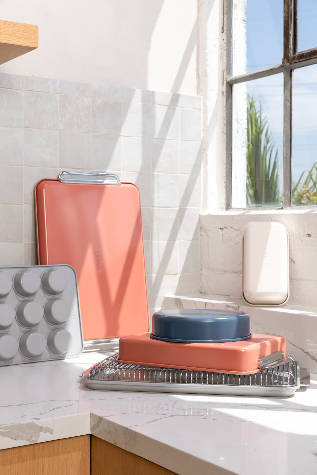 a Caraway bakeware stacked artfully on a counter, this versatile set has everything you need to bake your heart out