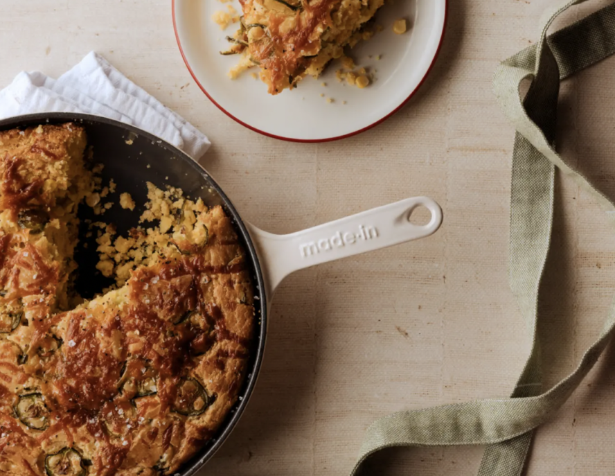 Image of the Made In Enameled Cast Iron Skillet in Antique White, used to bake an apple crumble.