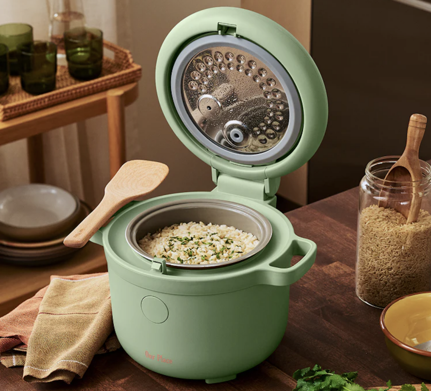 Image of the Our Place Rice Cooker in limited edition colorway Pistachio, full of cilantro rice.