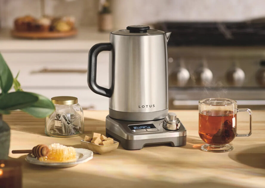 Image of the Lotus The Purist Precision Temperature Kettle shown on a wooden kitchen island.