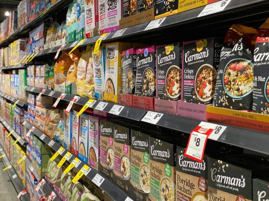 Image of grocery store shelves stocked with various boxes of oat- and wheat-based products.